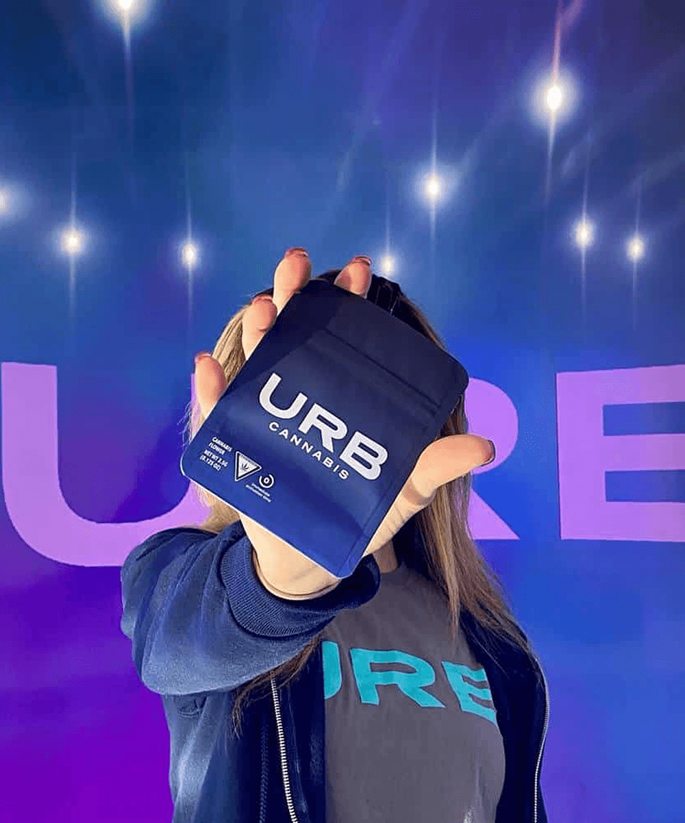 A Girl Showcasing URB Cannabis Product on Her Left Hand A Girl Showcasing URB Cannabis Product on Her Left Hand